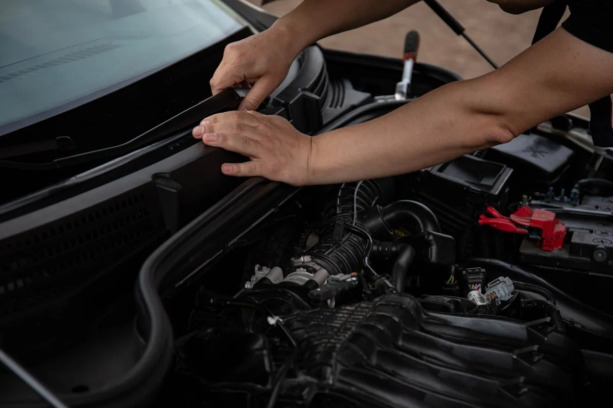 Auto glass service technician working on a car in Cocoa